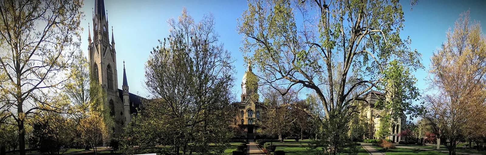 University of Notre Dame campus — A view of the Basilica of the Sacred Heart (left), the Main Building (center), and Washington Hall (right) at the Univer